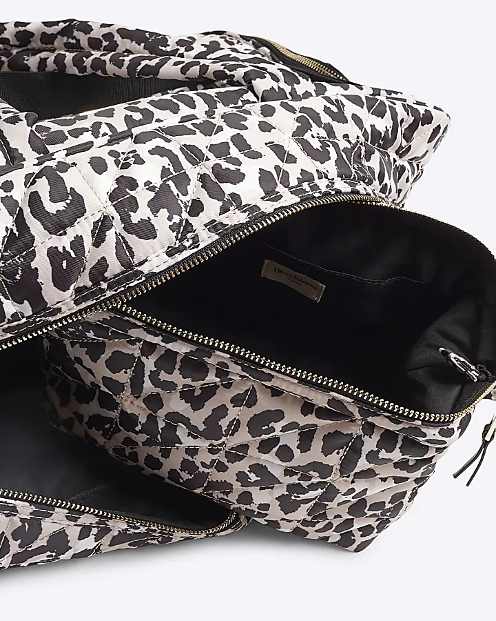 Beige quilted leopard travel and makeup bag