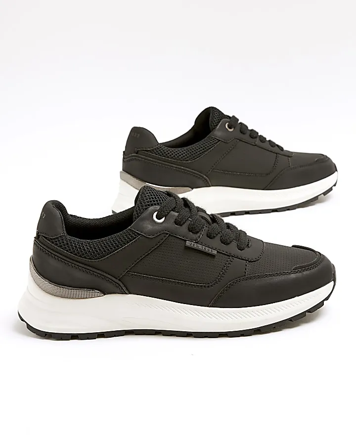 Black panelled trainers