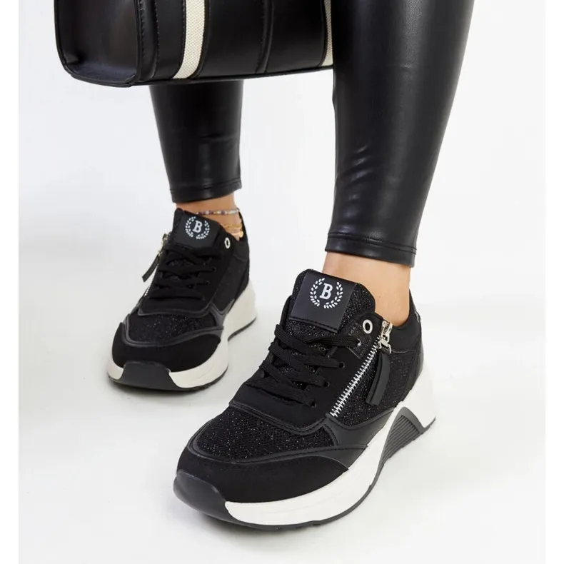 Black shiny sneakers on the Makda platform